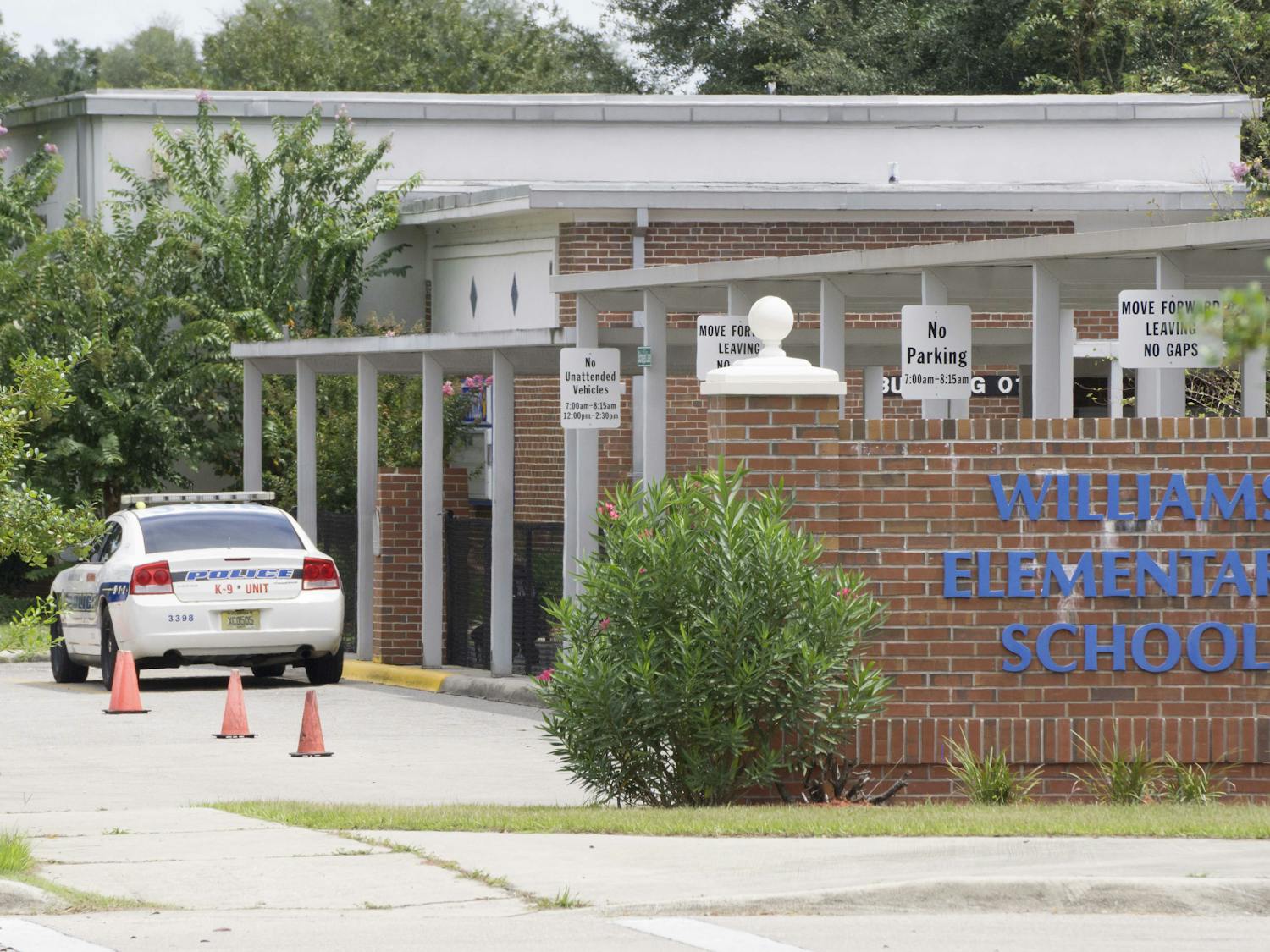 An Alachua County Sheriff's Office police car is stationed outside Joseph Williams Elementary School Aug. 28, 2015.