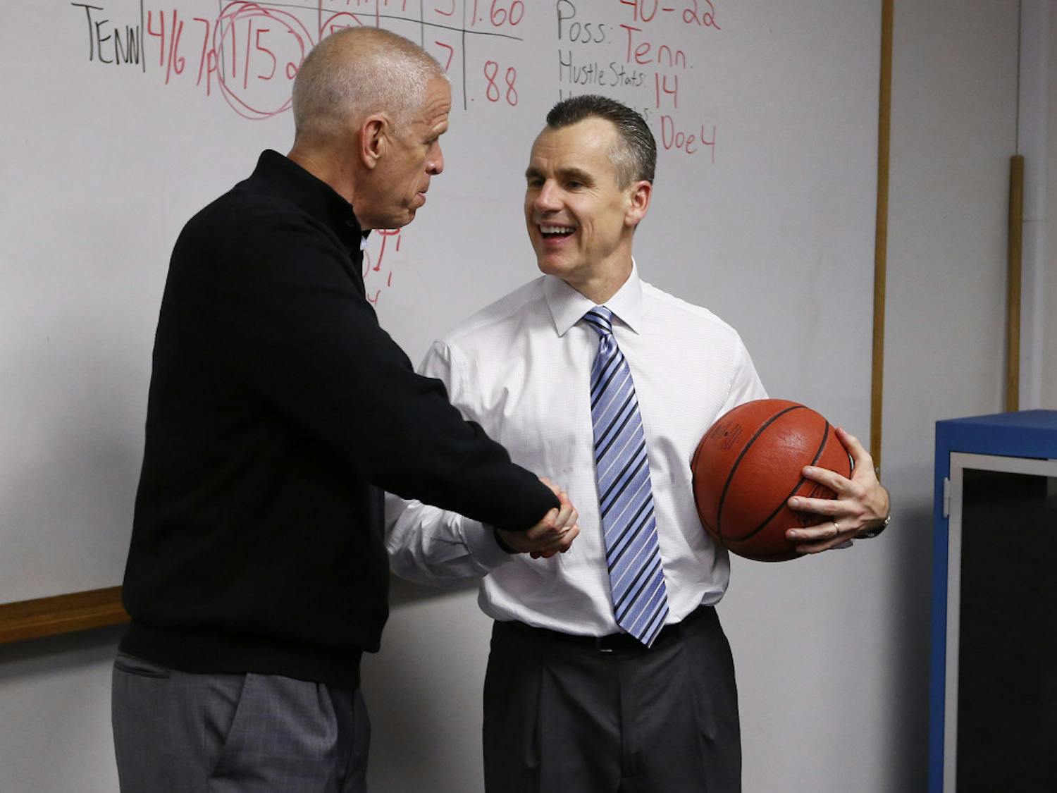 Jeremy Foley shakes hands with Billy Donovan during the Gators' game against the Tennessee Volunteers on Saturday, February 28, 2015, at the Stephen C. O'Connell Center in Gainesville, FL / UAA Communications photo by Tim Casey