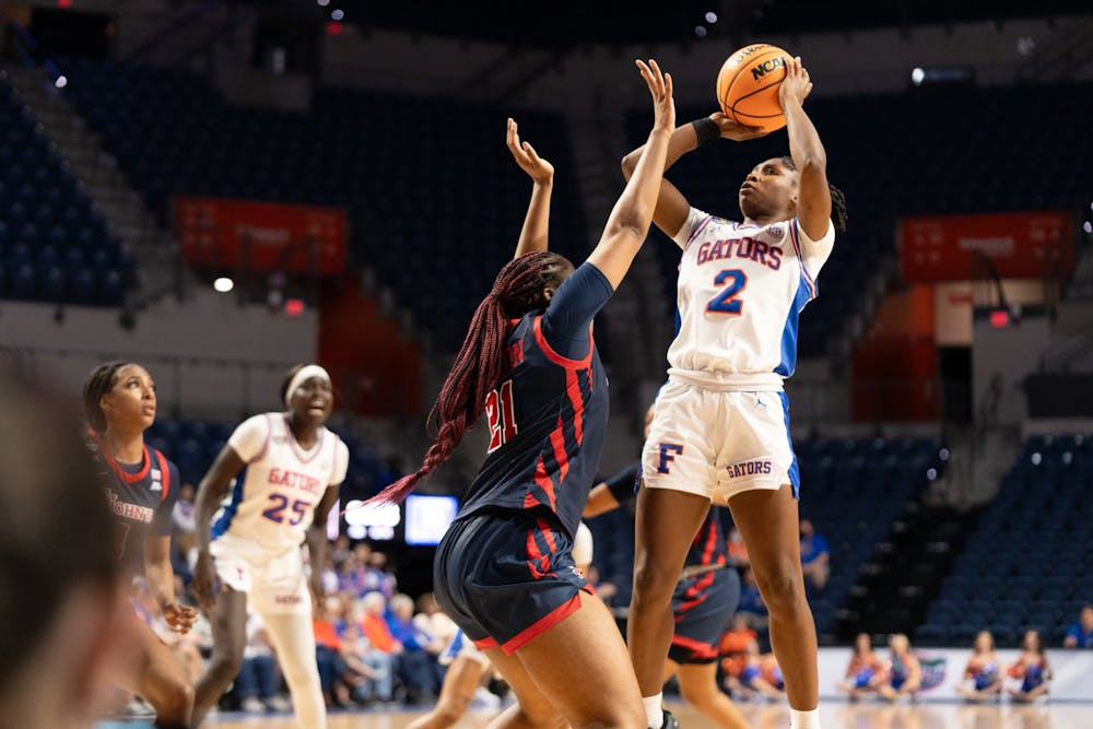 Gators women's basketball guard Aliyah Matharu shoots a jumper over a St.John's University defender in the team's loss to the Red Storm on Thursday, March 21, 2024. 