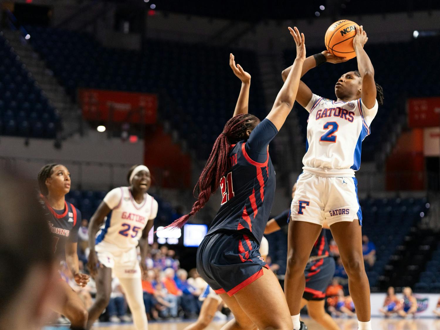 Gators women's basketball guard Aliyah Matharu shoots a jumper over a St.John's University defender in the team's loss to the Red Storm on Thursday, March 21, 2024.