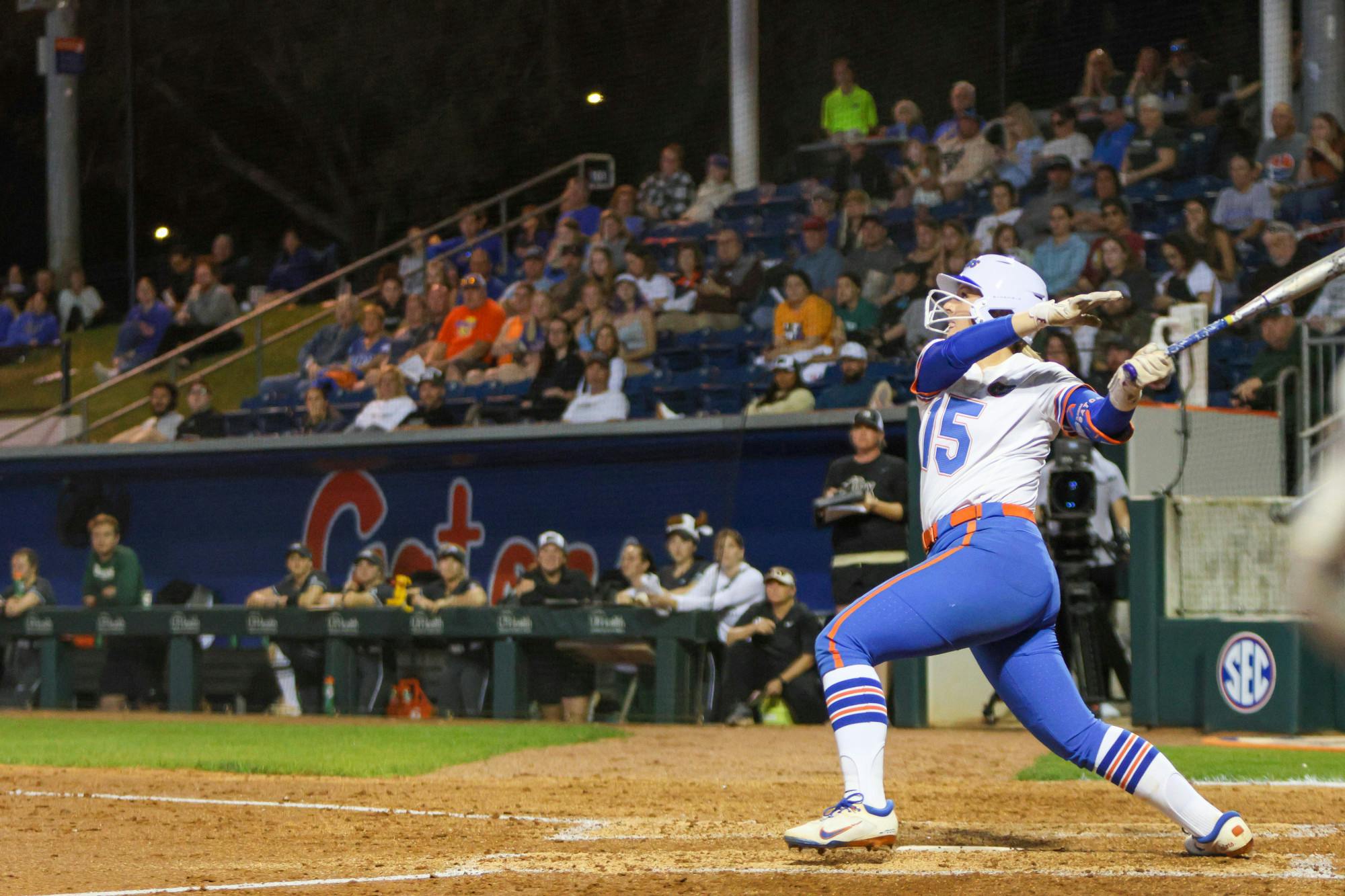 Second baseman Reagan Walsh hits the ball in an 11-0 victory against the Jacksonville Dolphins Wednesday, Feb. 15, 2023. 