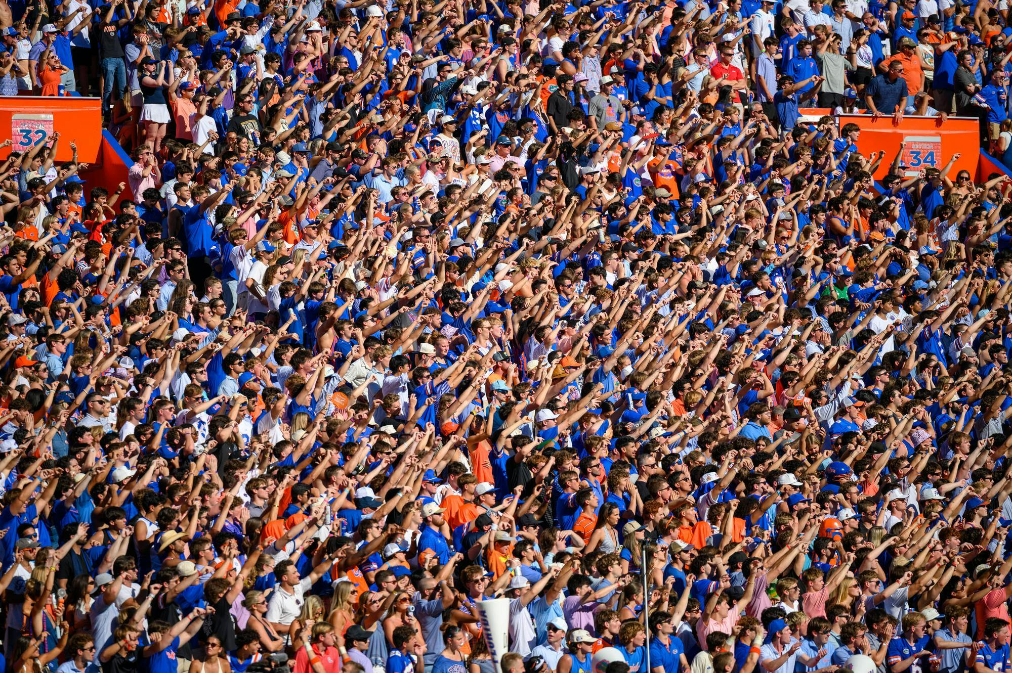Fans hold up their hands on a Florida third down during the first half of an NCAA college football game against Ole Miss, Saturday, Sept. 26, 2026, in Gainesville, Fla.