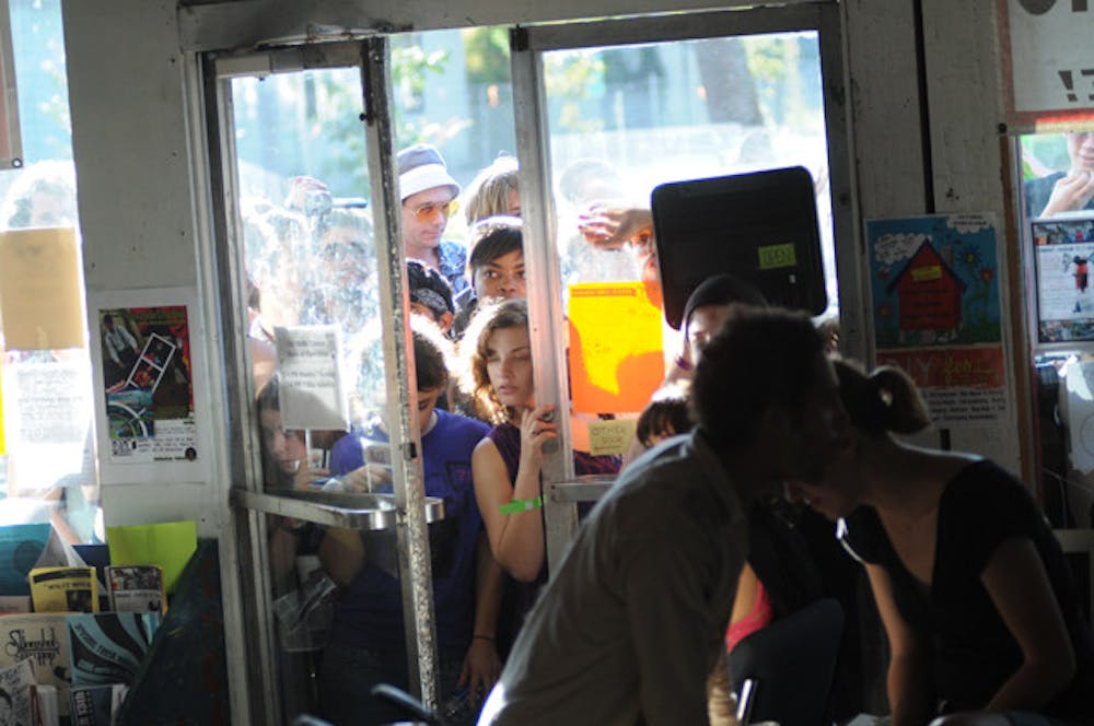 <p>Concert-goers crowd around the door of the Civic Media Center before a show during the Fest in October 2009. The Fest 10 is scheduled for Oct. 28 through 30 at 11 venues in Gainesville.</p>