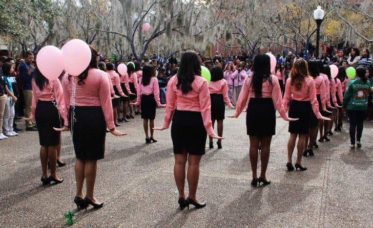 Sisters of the Iota Lambda chapter of the Alpha Kappa Alpha sorority celebrate the 106th year of their sorority on Turlington Plaza on Wednesday afternoon. &nbsp;