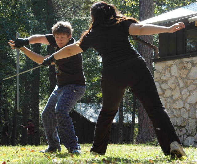 Chet Scott and Shael Millheim practice fighting with swords at O'Leno State Park. Scott and Millheim are part of the Thieves Guild, a group that does most of the performances at the annual Hoggetowne Medieval Faire.