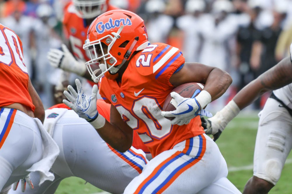 <p>Malik Davis runs with the ball during Florida's 38-24 win against Vanderbilt Saturday at Ben Hill Griffin Stadium.</p>