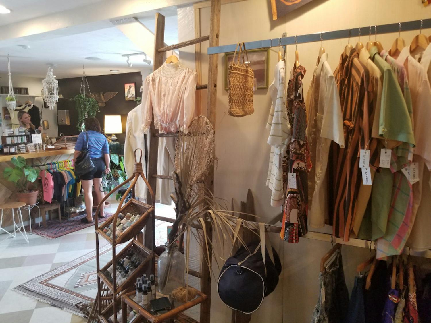 Sam Salay helping a customer at the AUK Market.