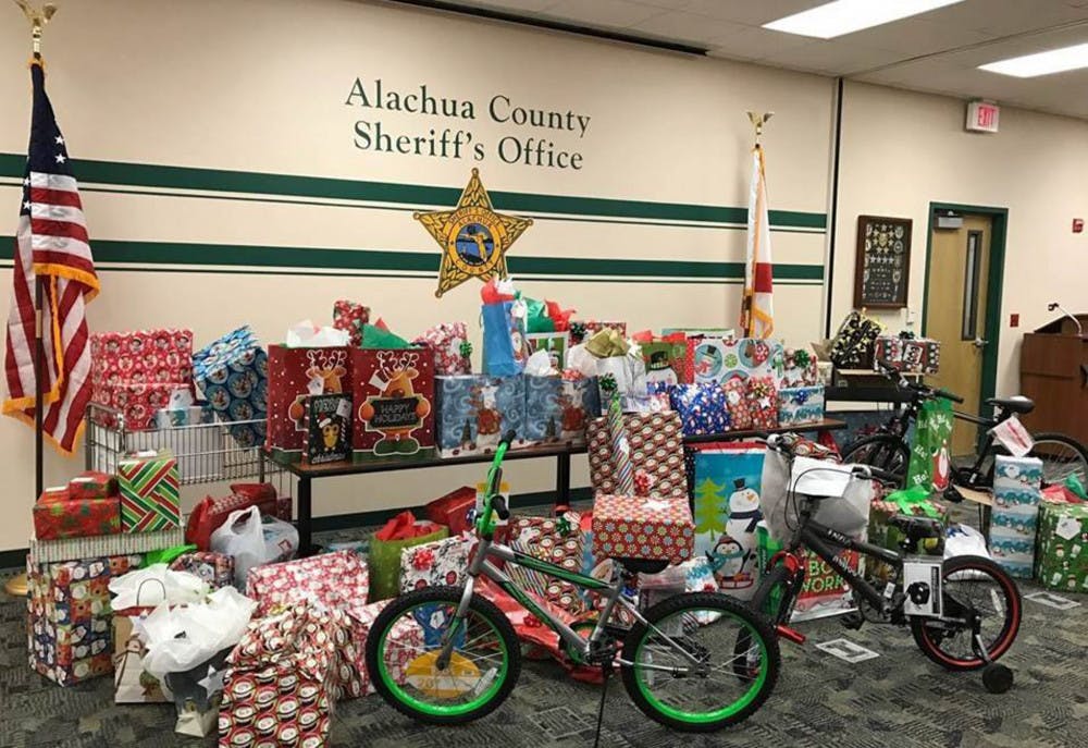 In Gainesville, police officers and sheriff’s deputies are embracing the holiday season by donating their time — and toys — to the community. On Friday, Gainesville Police officers will take elementary-school children on a shopping spree to Target as a part of its annual Heroes and Helpers event. Last week, the Alachua County Sheriff’s Office handed out gifts to children who had been taken from abusive or neglectful homes.