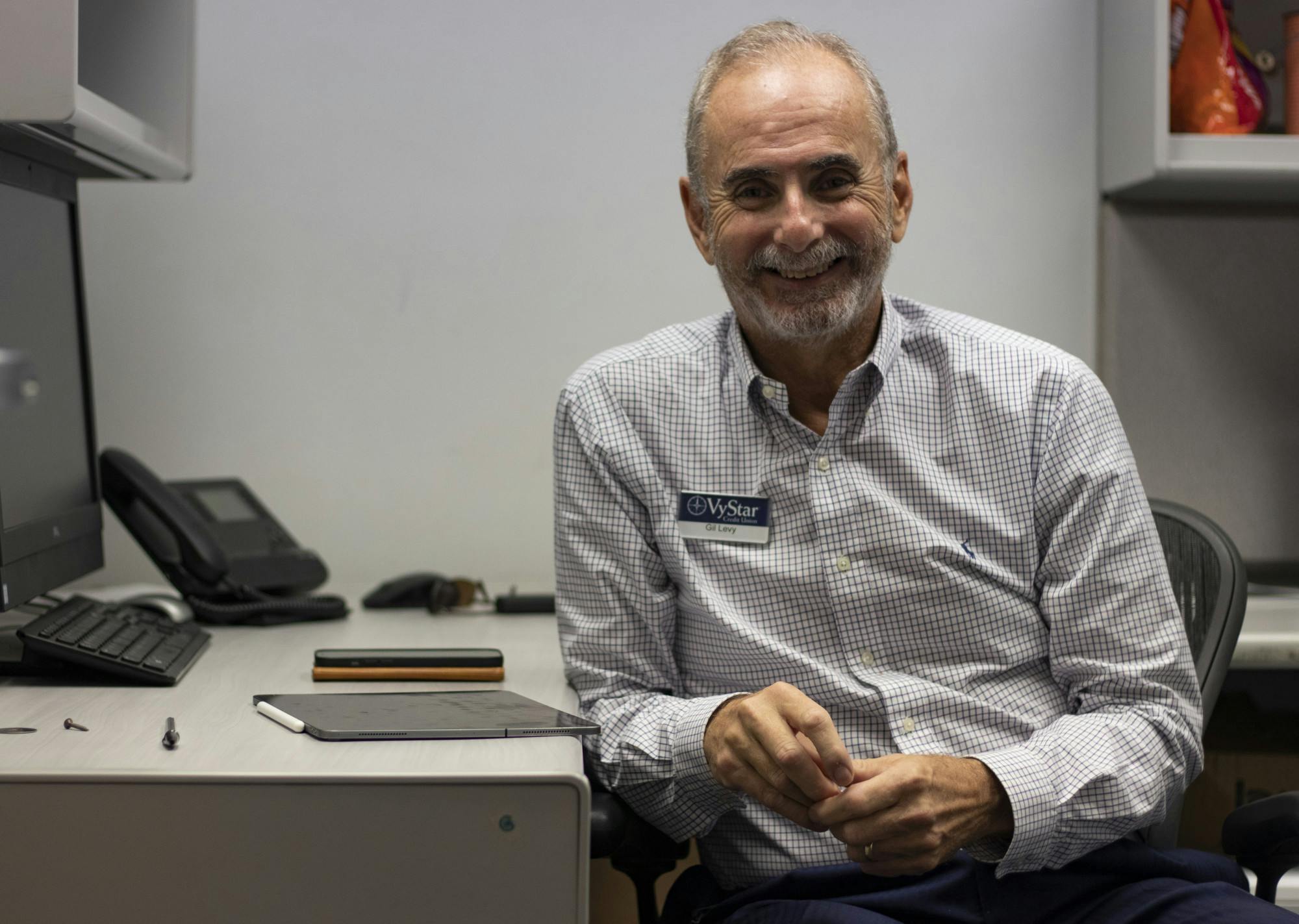 Gilbert "Gil" Levy, VyStar Credit Union senior vice president, sits in Santa Fe College's Financial Wellness Center on  Friday, Sept. 22, 2021. This room is the temporary center until remodels due to flooding are completed on the first floor. Levy will be the representative in the center until around December while he asseses the program and its needs. 