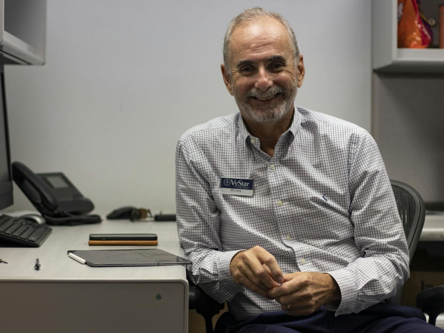 Gilbert "Gil" Levy, VyStar Credit Union senior vice president, sits in Santa Fe College's Financial Wellness Center on Friday, Sept. 22, 2021. This room is the temporary center until remodels due to flooding are completed on the first floor. Levy will be the representative in the center until around December while he asseses the program and its needs.