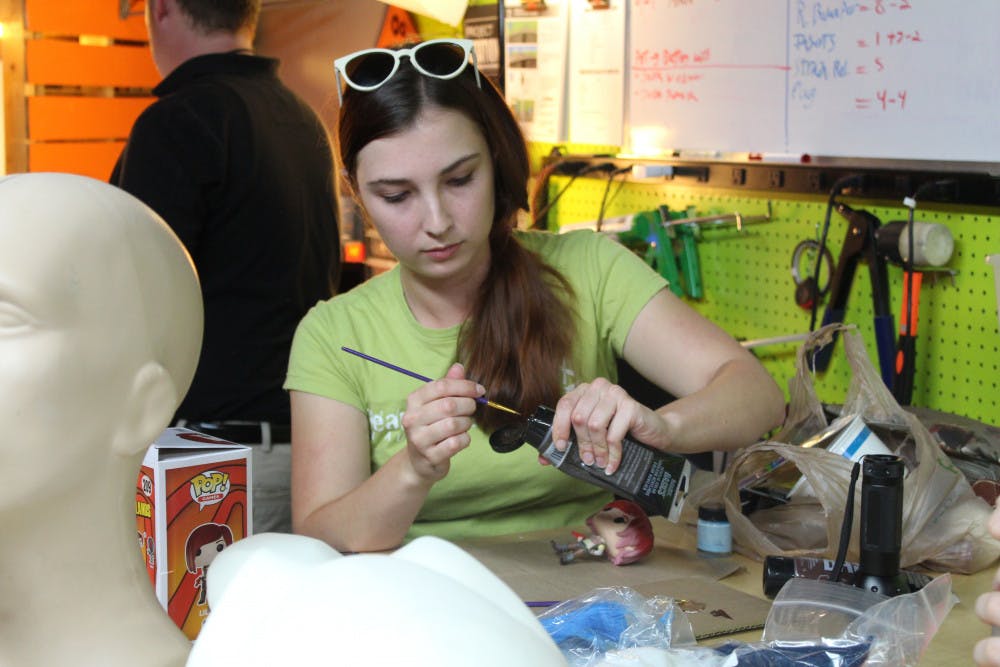 <p><span>Jessica </span><span>Hvozdovich, 24, repaints a figurine of Lilith from the video game "Borderlands 2." She was one of about 15 people who attended a cosplay workshop event at Hackerspace.</span></p>