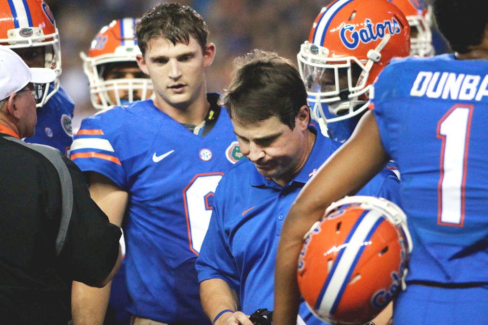 Florida head coach Will Muschamp turns away from a time-out talk with the Gators offense during Florida's 30-27 loss to LSU on Oct. 11 at Ben Hill Griffin Stadium.