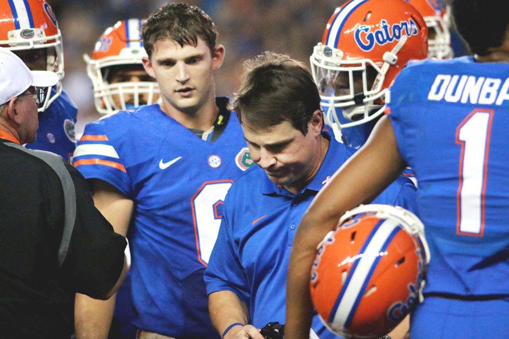 <p>Florida head coach Will Muschamp turns away from a time-out talk with the Gators offense during Florida's 30-27 loss to LSU on Oct. 11 at Ben Hill Griffin Stadium.</p>