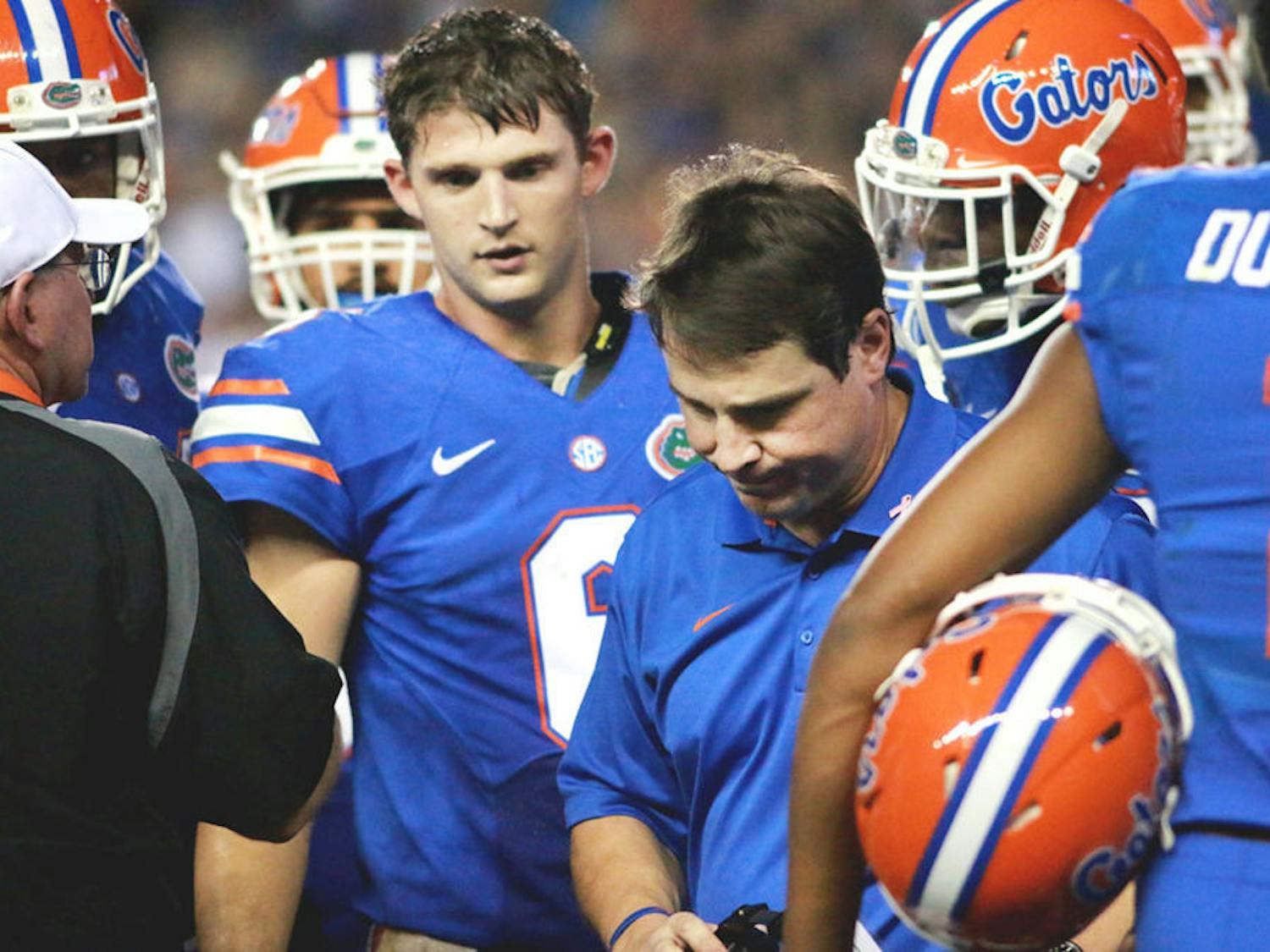 Florida head coach Will Muschamp turns away from a time-out talk with the Gators offense during Florida's 30-27 loss to LSU on Oct. 11 at Ben Hill Griffin Stadium.