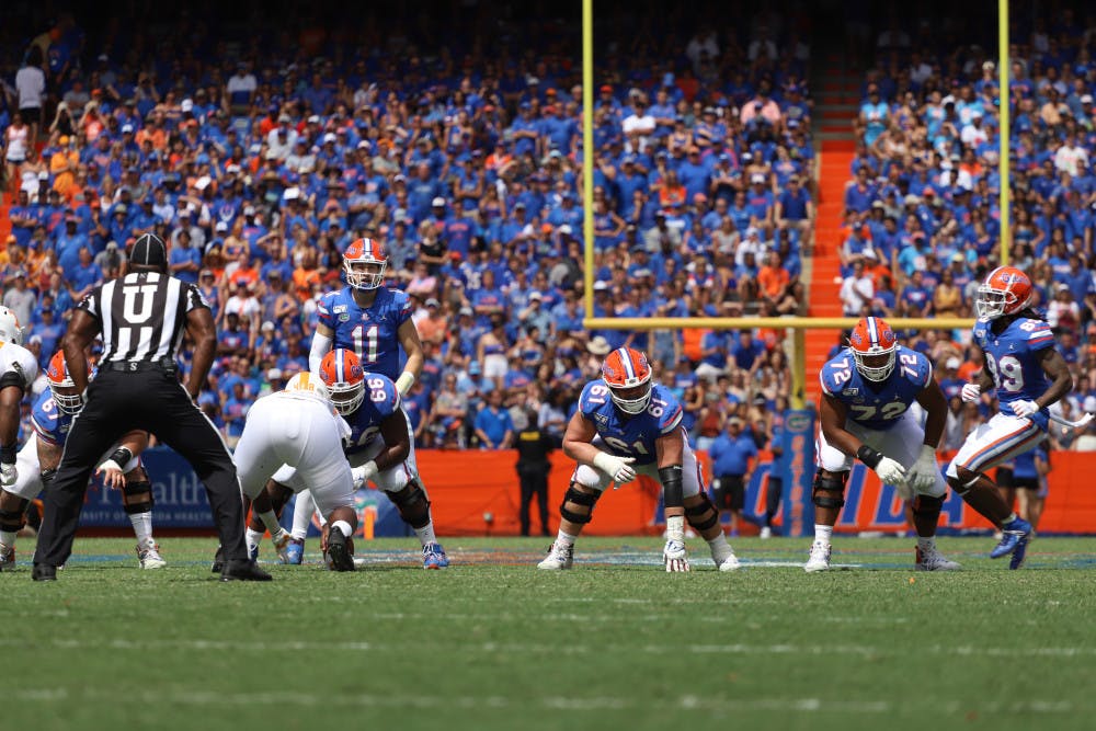 <p>Offensive lineman Brett Heggie (61) lined up in front of quarterback Kyle Trask at Florida's game against Tennessee last year. During quarantine, Heggie said he practiced all three interior positions in preparation for this season.</p>