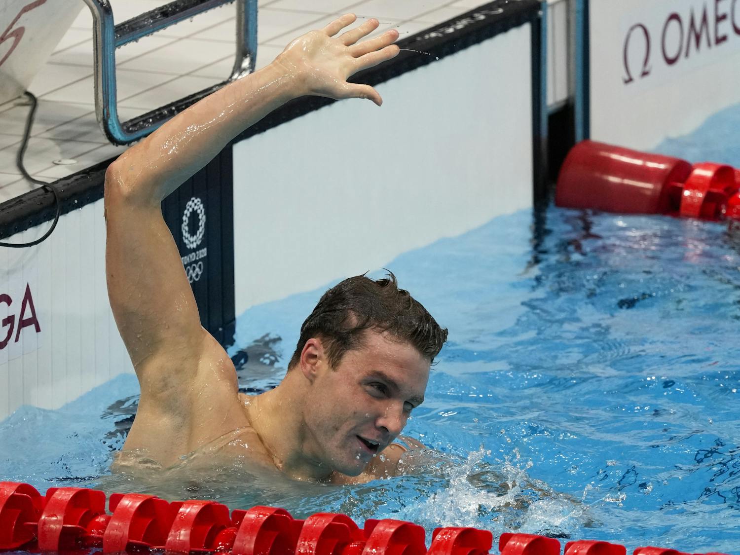 Robert Finke, of United States, celebrates after winning the gold medal in the men's 1500-meter freestyle final at the 2020 Summer Olympics, Sunday, Aug. 1, 2021, in Tokyo, Japan. (AP Photo/Jae C. Hong)