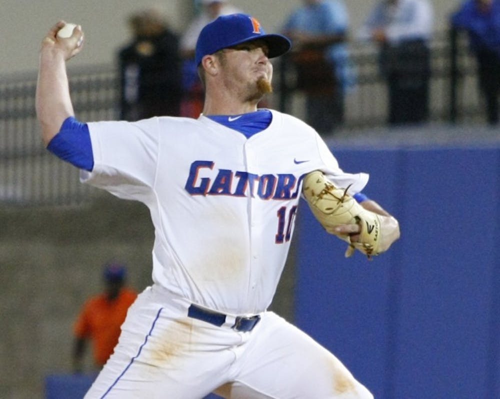 <p>Florida relief pitcher Austin Maddox throws a pitch against Samford on March 20. Like the rest of the back end of the Gators’ bullpen, Maddox has logged significant innings this season.</p>