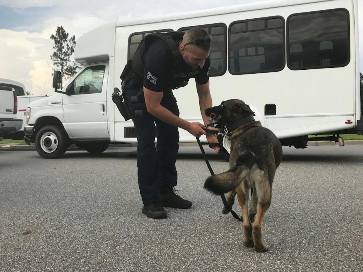 Ares gets to play with his reward toy, a red rubber pipe, after finding the scent. K-9 dogs are trained with reward toys to encourage certain behavior.