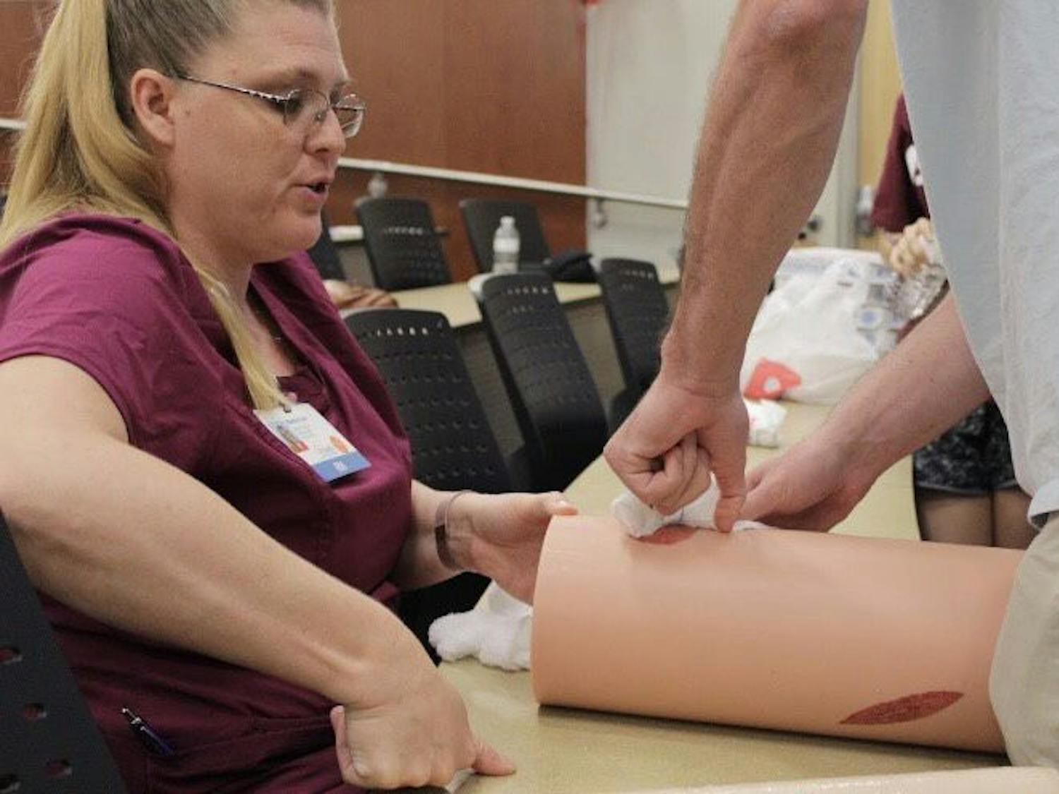 Students practiced stuffing fake bullet hole wounds with gauze Saturday morning. The two-hour-long educational training taught attendees what to do when someone has life-threatening bleeding in an emergency.&nbsp;