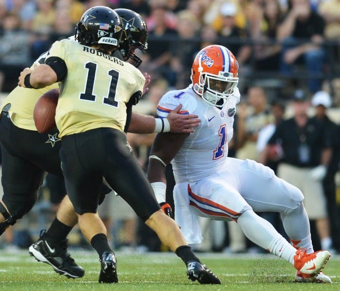 Senior linebacker Jon Bostic (1) pursues Vanderbilt quarterback Jordan Rodgers (11) during Florida's 31-17 win on Saturday at Vanderbilt Stadium in Nashville, Tenn.