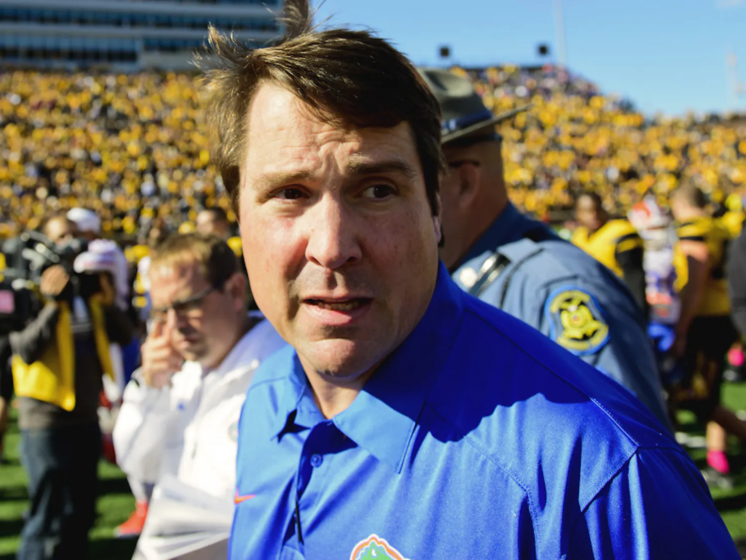 Florida coach Will Muschamp gazes at the Missouri crowd and reflects after the No. 22 Gators' 36-17 loss to the No. 14 Tigers on Oct. 19 in Faurot Field in Columbia, Mo.