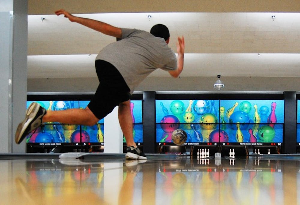 <p>Tyler Wells, 18-year-old biology freshman, sets up for a strike at the Reitz Union Game Room on Thursday. The UF Bowling Club meets Tuesdays and Thursdays at 6 p.m.</p>