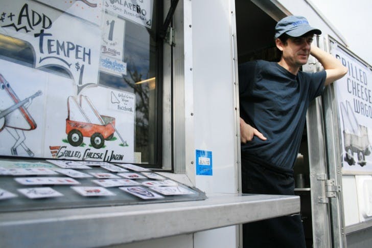 Jason Howey, 36, of Williston, works at the Grilled Cheese Wagon food truck. He'll soon be on the road serving at Florida music festivals.