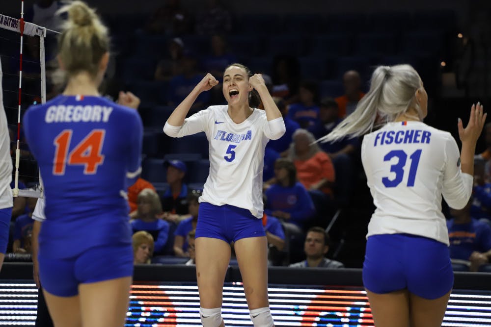 Rachel Kramer celebrates with her teammates.