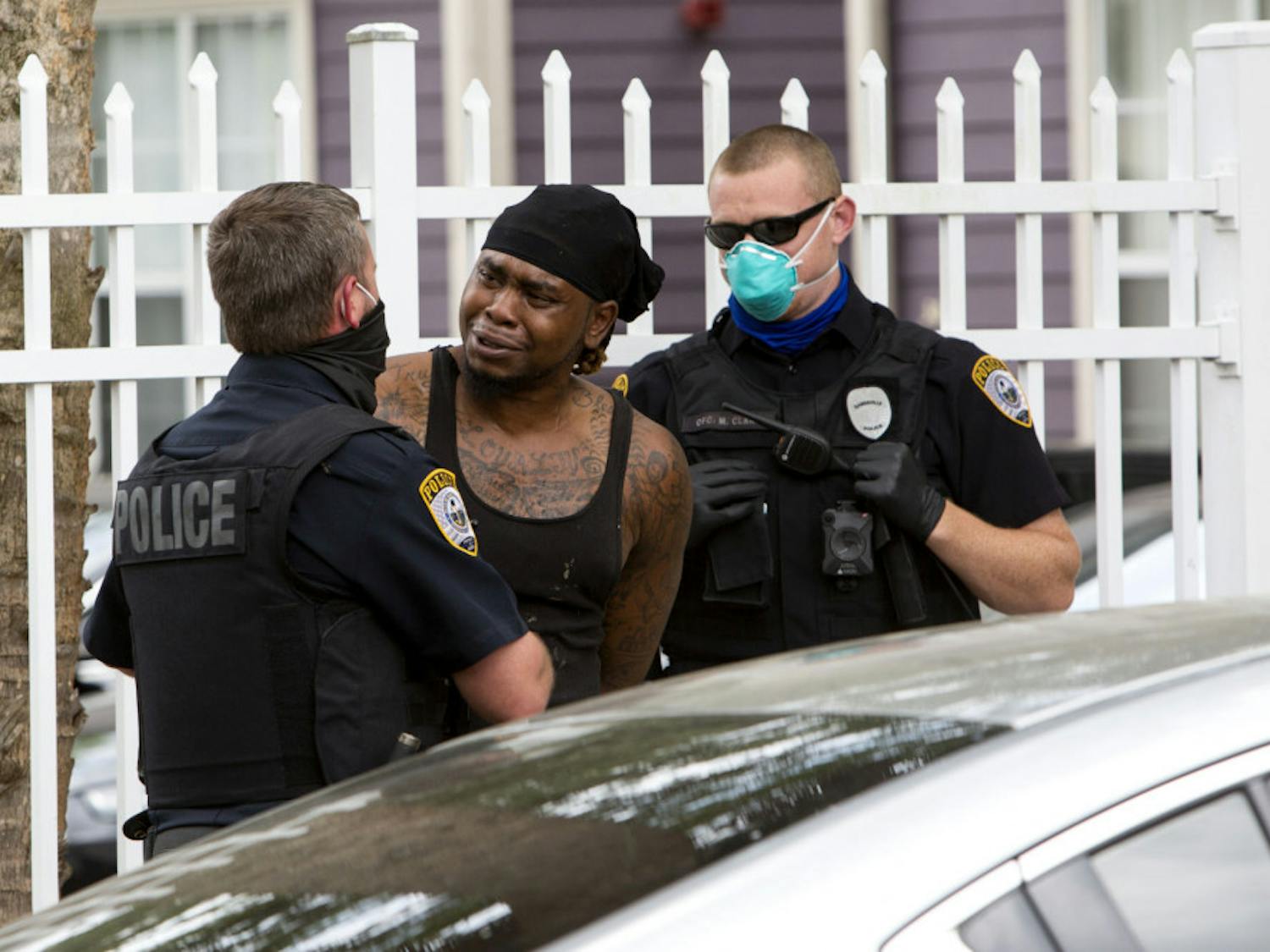 Allen Strawder, 31, is arrested by Gainesville Police Department officers on April 8, 2020, in downtown Gainesville&nbsp;and is accused of battery.&nbsp;Strawder was given a mask to wear in the back of the police vehicle. GPD is following Centers for Disease Control guidelines on interaction with the public, which include recommendations to wear cloth masks, according to spokesperson Sgt. Lisa Scott. There is a stay-at-home order in place in Florida to prevent the spread of COVID-19.
