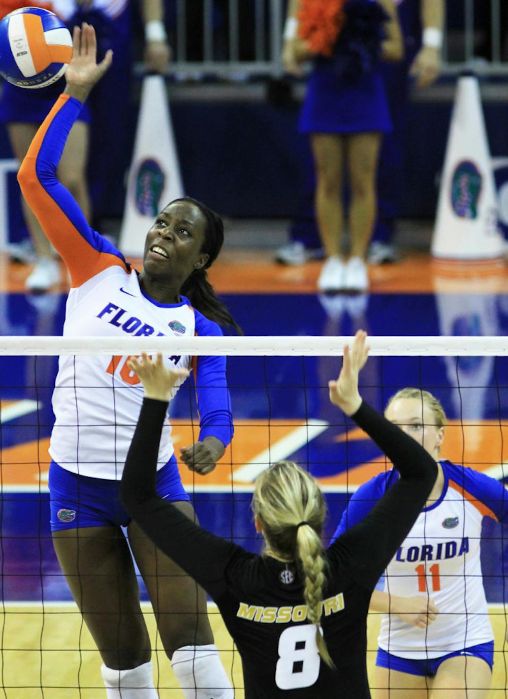 <p>Chloe Mann (10) spikes the ball over Missouri’s Whitney Little (8) during UF’s 3-0 win on Sept. 21, 2012, in the Stephen C. O’Connell Center.</p>