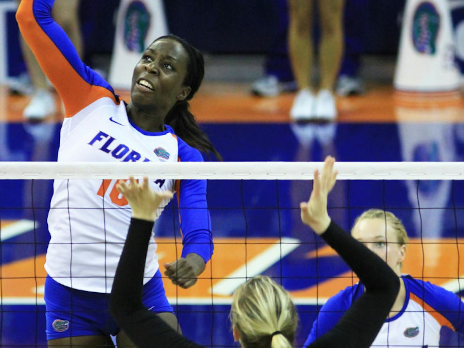 Chloe Mann (10) spikes the ball over Missouri’s Whitney Little (8) during UF’s 3-0 win on Sept. 21, 2012, in the Stephen C. O’Connell Center.