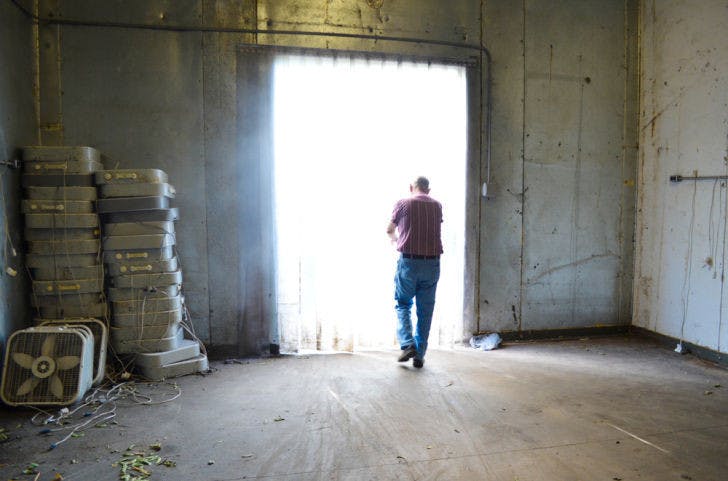 Larry Rogers, 75, exits a refrigerated storage room on his Alachua County farm Friday. Rogers locally sells beans, cucumbers, strawberries, onions, tomatoes and other produce from his farm.
&nbsp;