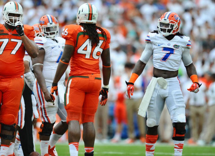 Ronald Powell recovers after a play against Miami on Sept. 7, 2013, at Sun Life Stadium. Powell announced that he would forego his final year of eligibility. The redshirt junior recorded 26 tackles and four sacks this season.