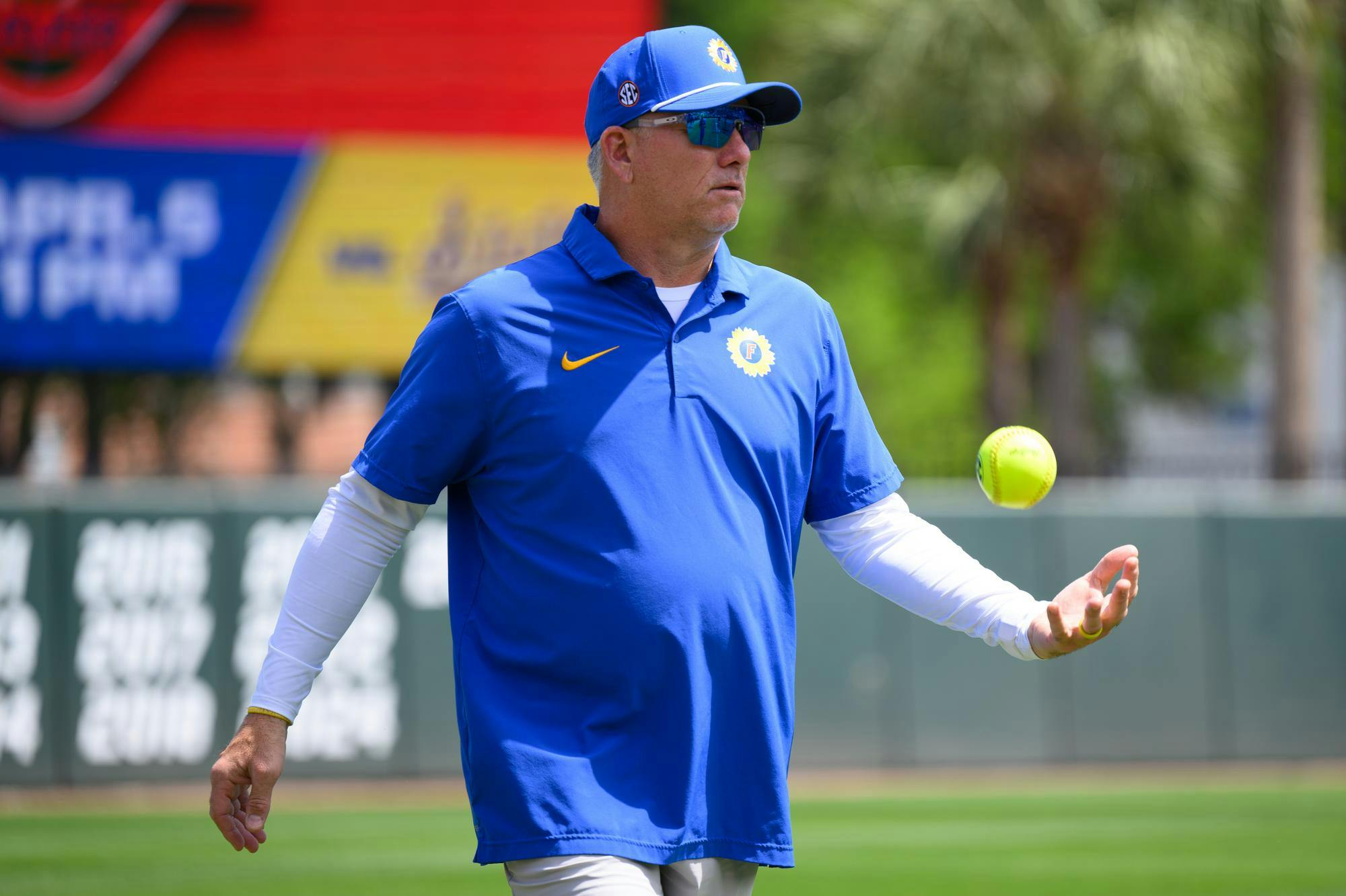 Florida head coach Tim Walton tosses a ball before an NCAA softball game against Mississippi State, Saturday, April 4, 2026, in Gainesville, Fla.