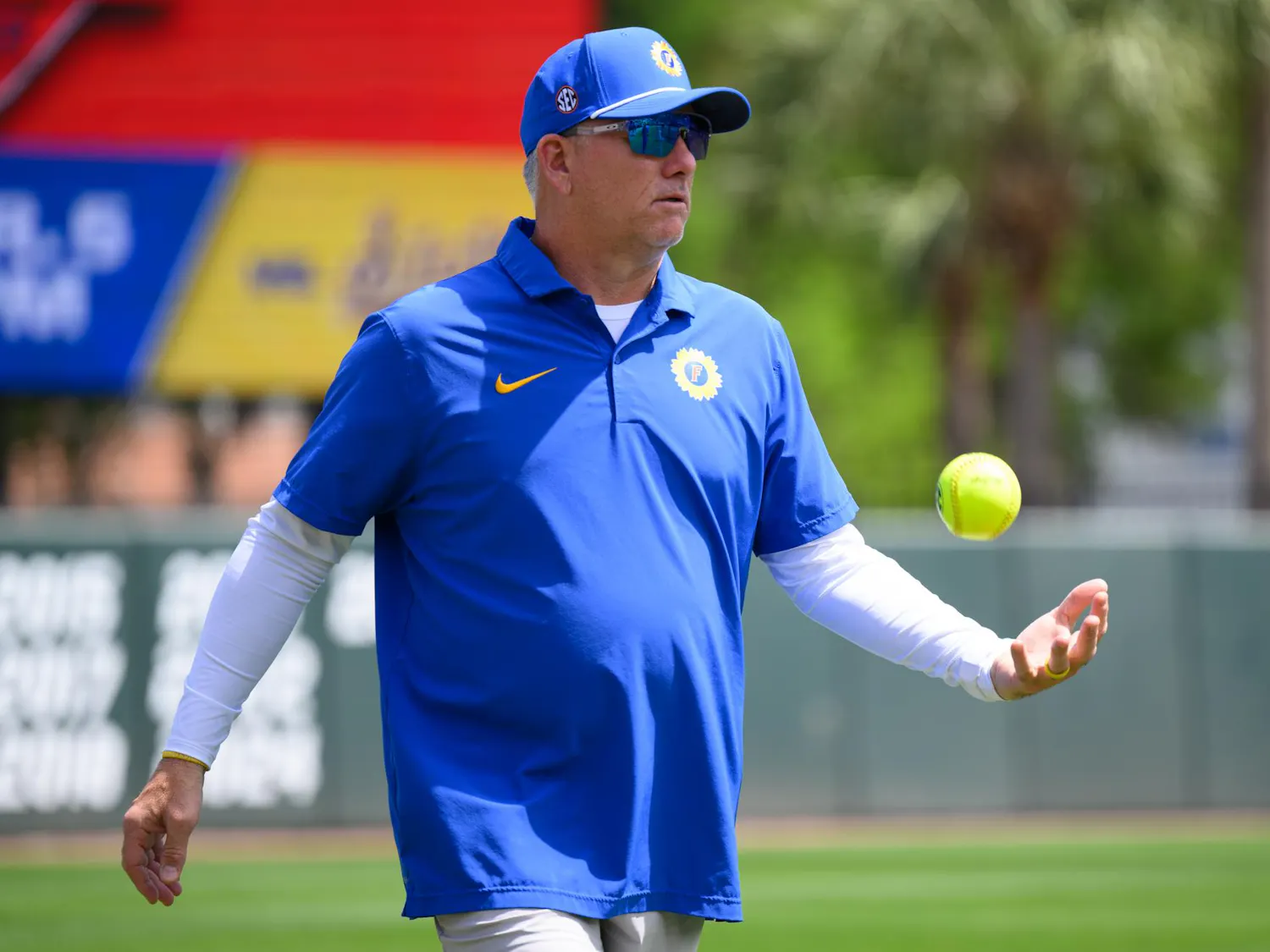 Florida head coach Tim Walton tosses a ball before an NCAA softball game against Mississippi State, Saturday, April 4, 2026, in Gainesville, Fla.
