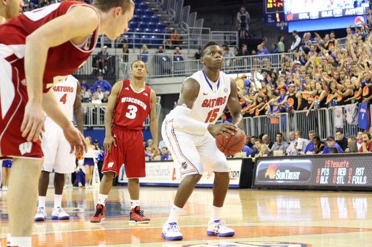 Junior forward Will Yeguete (15) prepares to shoot a free throw during Florida’s 74-56 win against Wisconsin on Nov. 14 in the O’Connell Center.