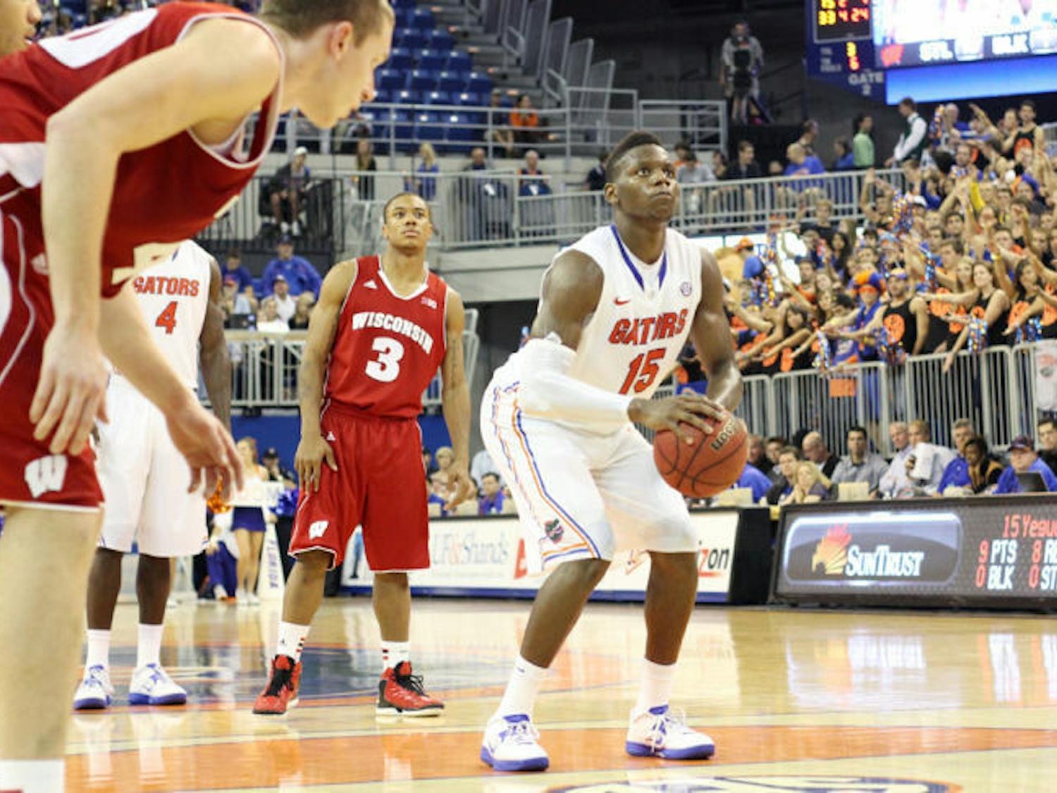 Junior forward Will Yeguete (15) prepares to shoot a free throw during Florida’s 74-56 win against Wisconsin on Nov. 14 in the O’Connell Center.
