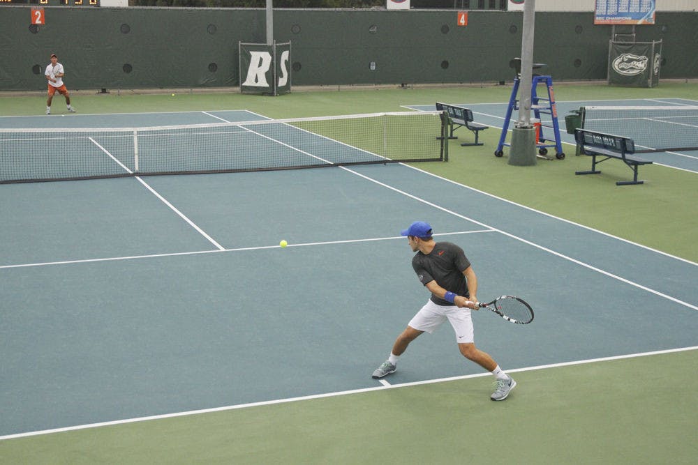 Elliot Orkin returns a ball during the Florida Invitational at UF's Ring Tennis Complex.