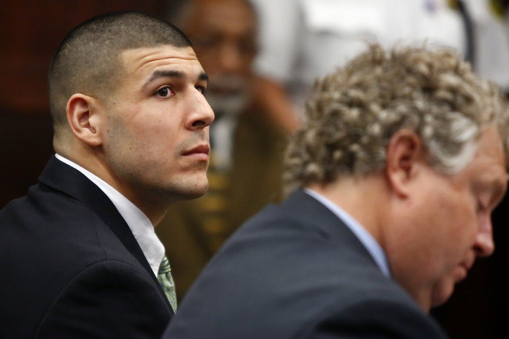 Former New England Patriots tight end Aaron Hernandez listens to the prosecution's summary of facts as he is arraigned on homicide charges at Suffolk Superior Court in Boston, Wednesday. Hernandez pleaded not guilty in the shooting deaths of Daniel de Abreu and Safiro Furtado. He already faces charges in the 2013 killing of semi-pro football player Odin Lloyd.