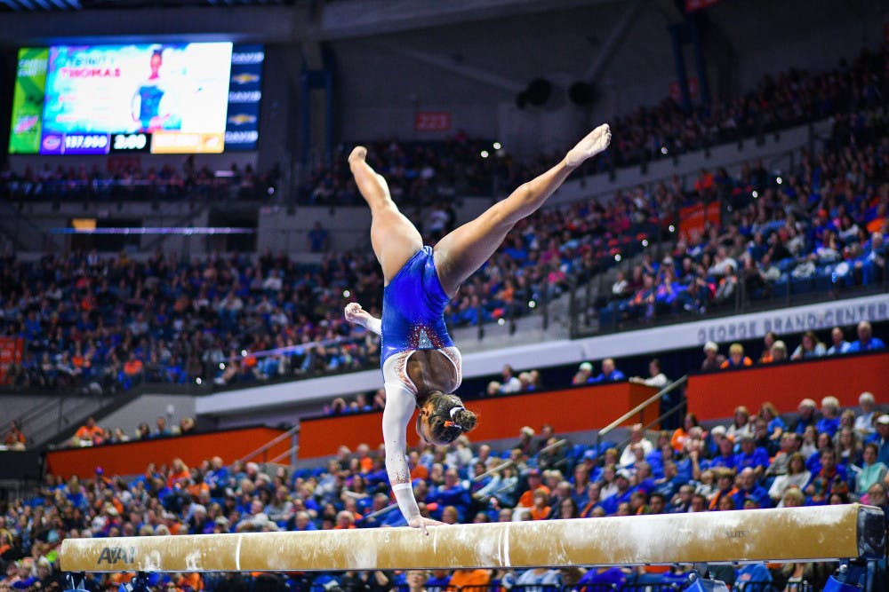 <p><span id="docs-internal-guid-6dc20774-7fff-7c88-f4bd-deaa7b02bd69">UF gymnast Trinity Thomas performs her beam routine against Missouri on Jan. 11. She scored a 9.850 for her performance.</span></p>