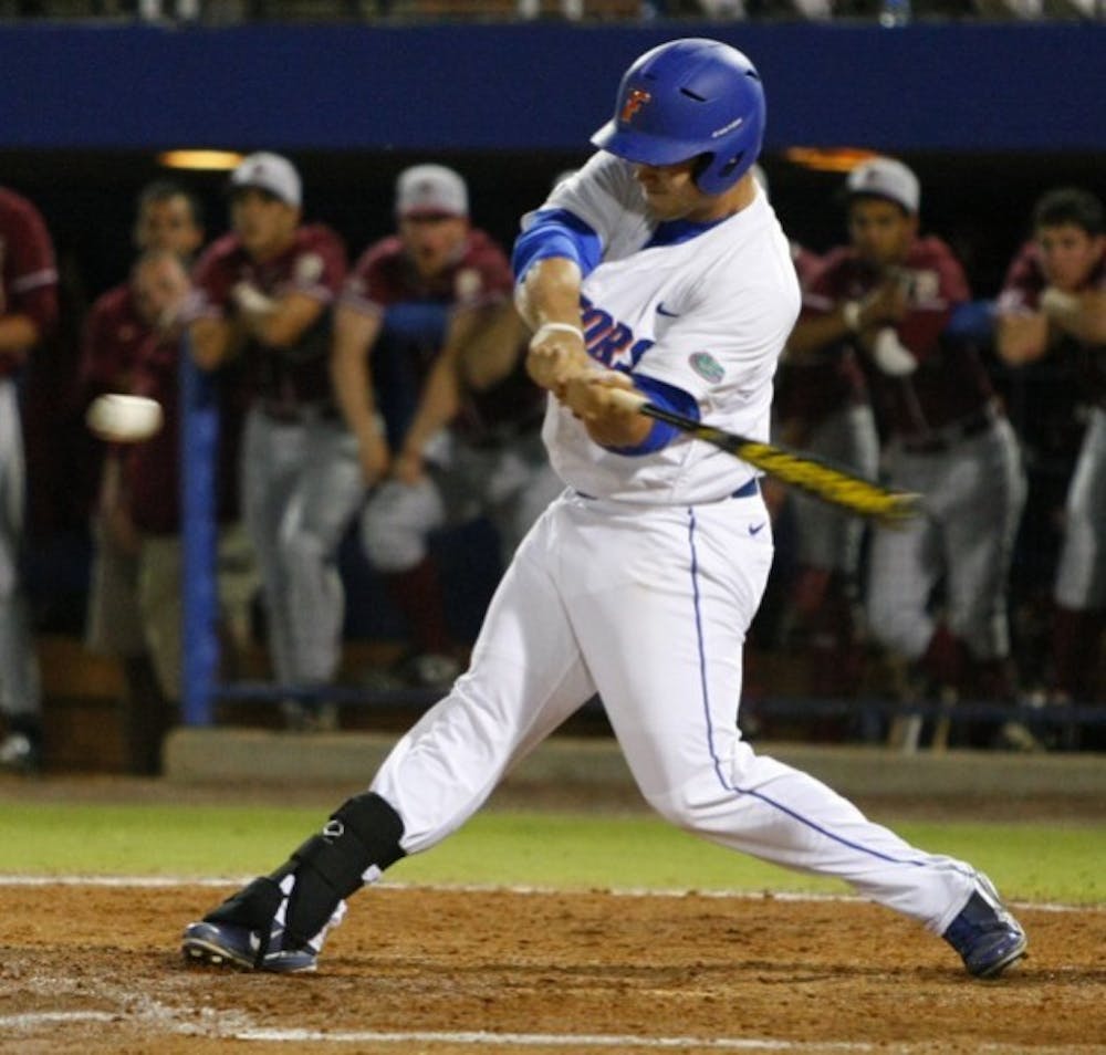 <p>Former Florida baseball player Preston Tucker hits a three-run home run in a 9-2 win against Florida State on March 13, 2012. Tucker will join the Houston Astros on Thursday.&nbsp;</p>