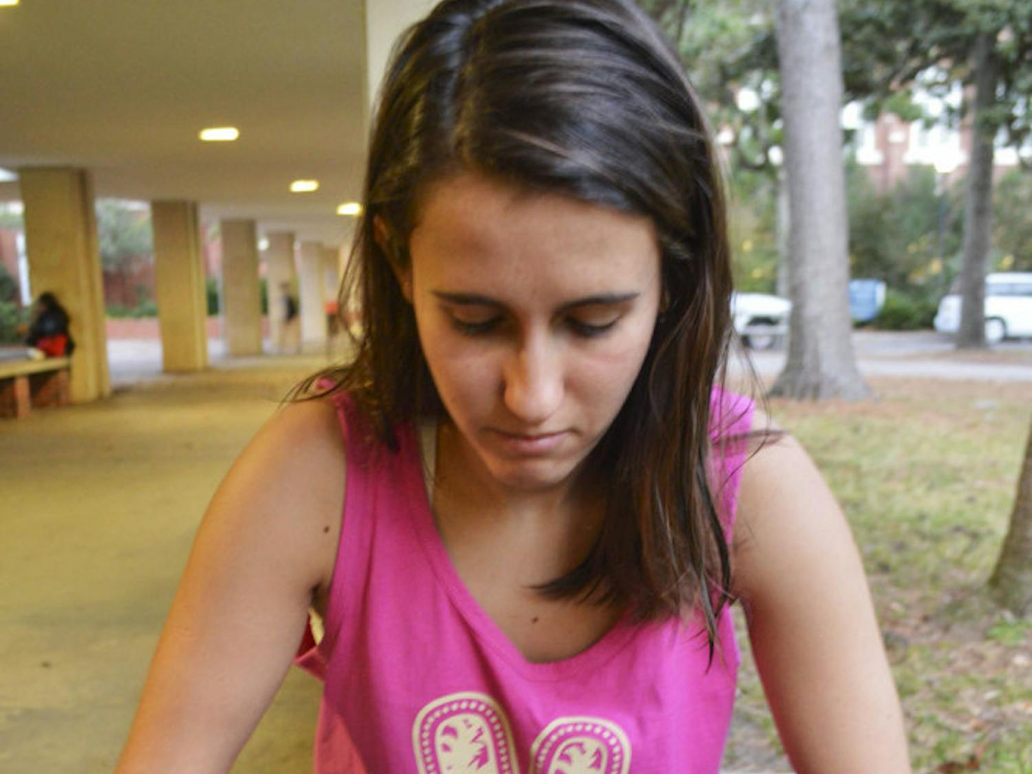 Luiza Costa, 21, studies for her finals outside Library West in a not-so-traditional way. “A huge part of my grade in my dendrology class is being able to identify leaves of different trees,” said the UF natural resource conservation junior. “It isn’t easy, but it’s more interesting than reading a book.”