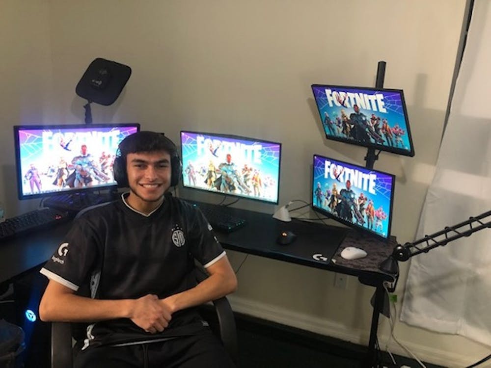 Emad Nasif, a 21-year-old Gainesville Twitch streamer, sits in front of his gaming set up where he streams his Fortnite plays to up to 1,500 viewers. 
