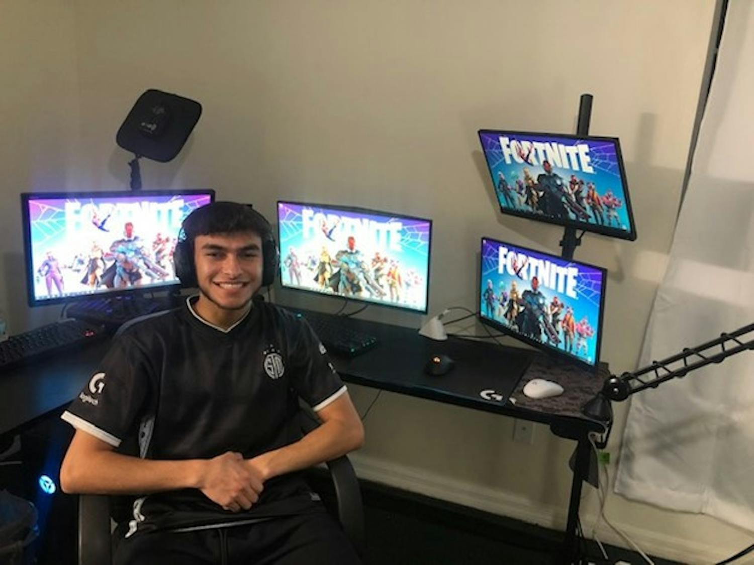 Emad Nasif, a 21-year-old Gainesville Twitch streamer, sits in front of his gaming set up where he streams his Fortnite plays to up to 1,500 viewers.