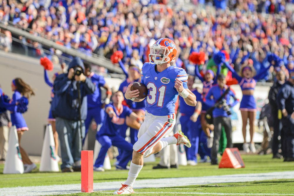 <p>UF wide receiver Mike McNeely runs into the endzone for a touchdown on a fake field goal trick play during Florida's 38-20 win against Georgia on Saturday at EverBank Field in Jacksonville.</p>