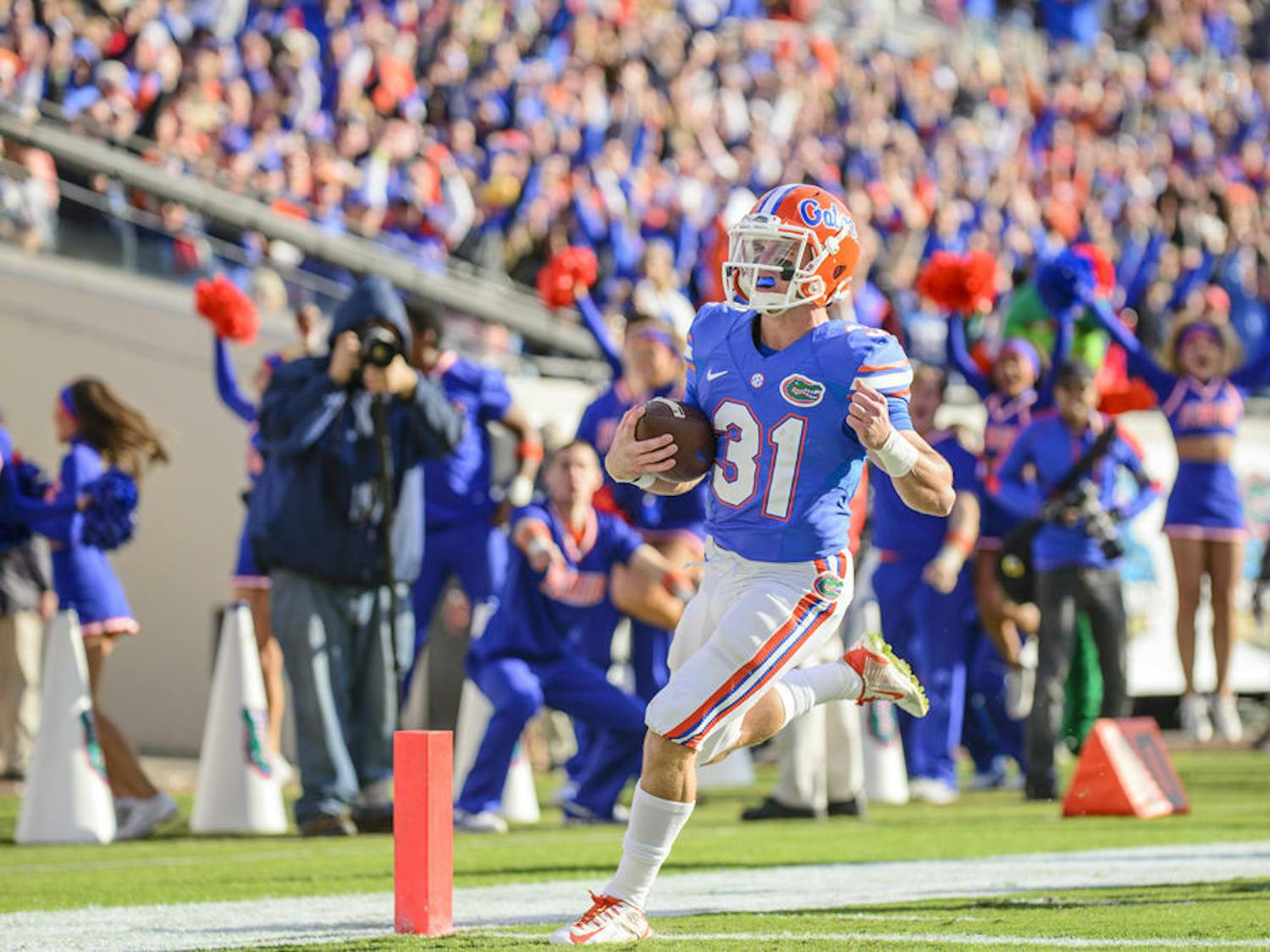 UF wide receiver Mike McNeely runs into the endzone for a touchdown on a fake field goal trick play during Florida's 38-20 win against Georgia on Saturday at EverBank Field in Jacksonville.