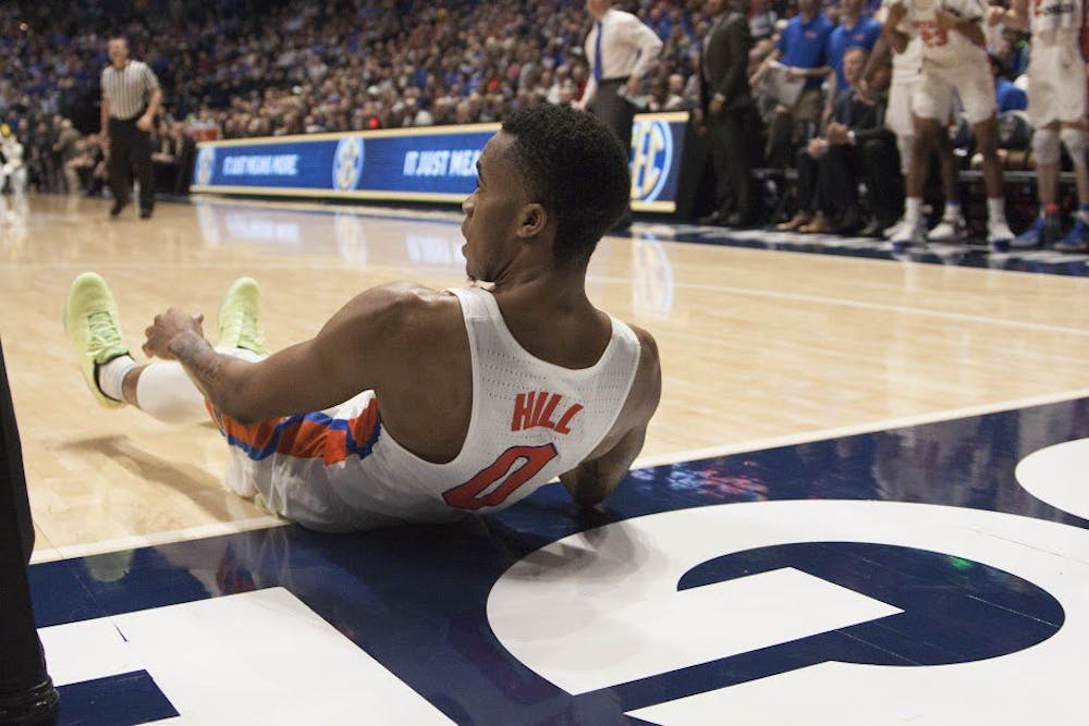 <p>UF guard Kasey Hill lies on the court during Florida's 72-62 loss to Vanderbilt in the Southeastern Conference Tournament on March 10, 2017, in Nashville, Tennessee.</p>