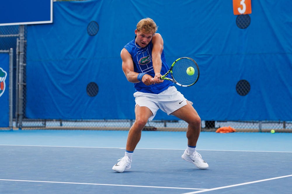 Florida tennis player Kevin Edengren hits the ball during an NCAA tennis match against Vanderbilt, Thursday, April 2, 2026, in Gainesville, Fla.