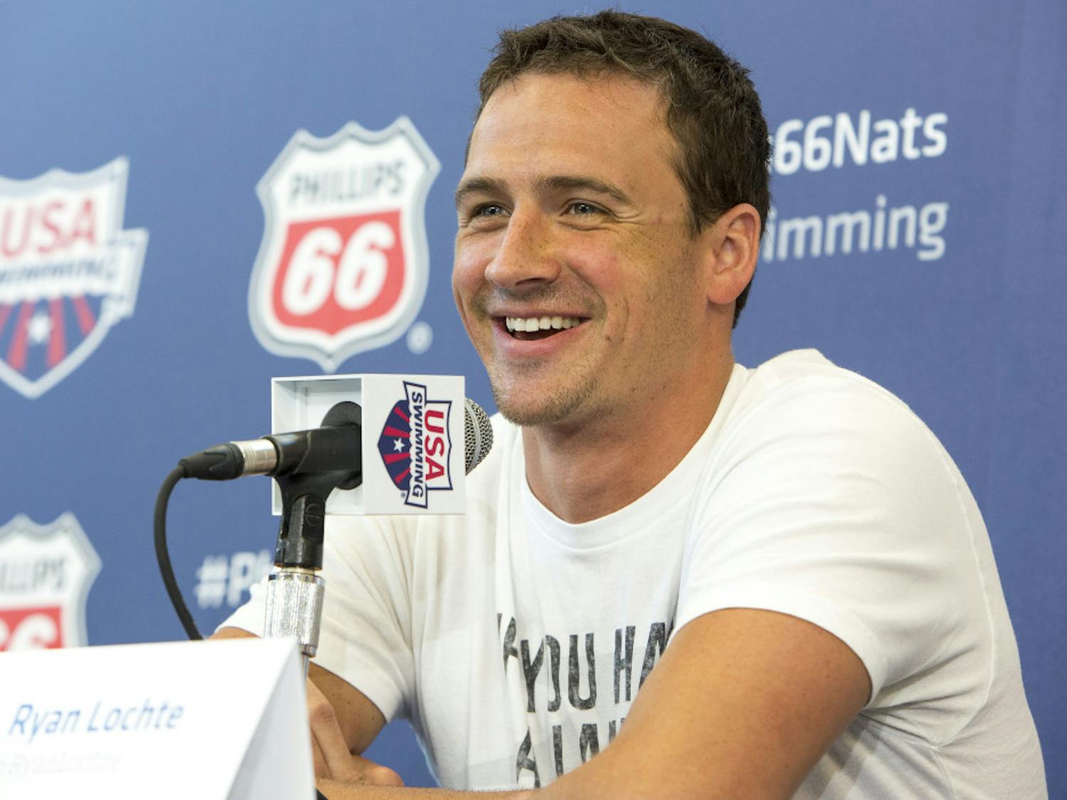 Olympic gold medalist Ryan Lochte smiles as he takes questions from the media at the U.S. swimming nationals news conference in Irvine, Calif., on Tuesday.