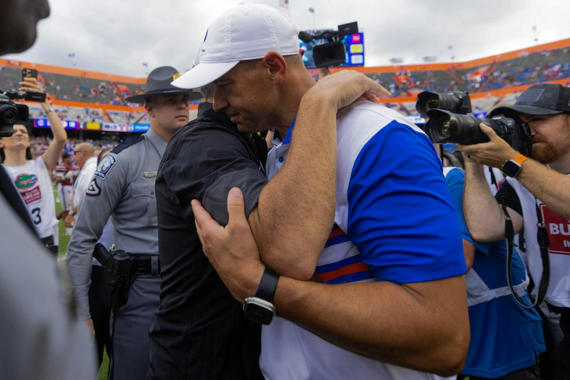 Florida head coach Jon Sumrall embraces South Carolina head coach Shane Beamer an NCAA college football game, Saturday, Oct. 10, 2026, in Gainesville, Fla.